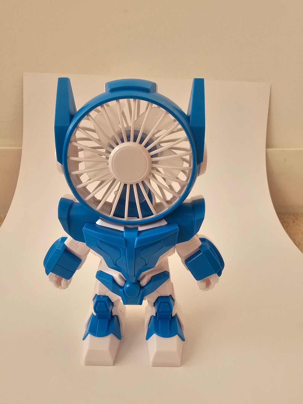 A futuristic robot-style handheld fan