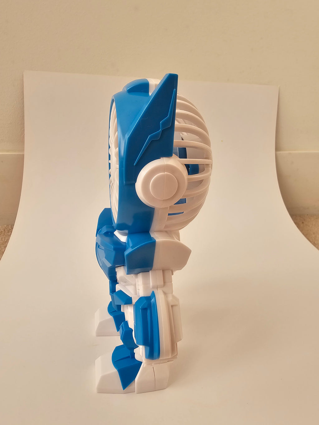 A futuristic robot-style handheld fan