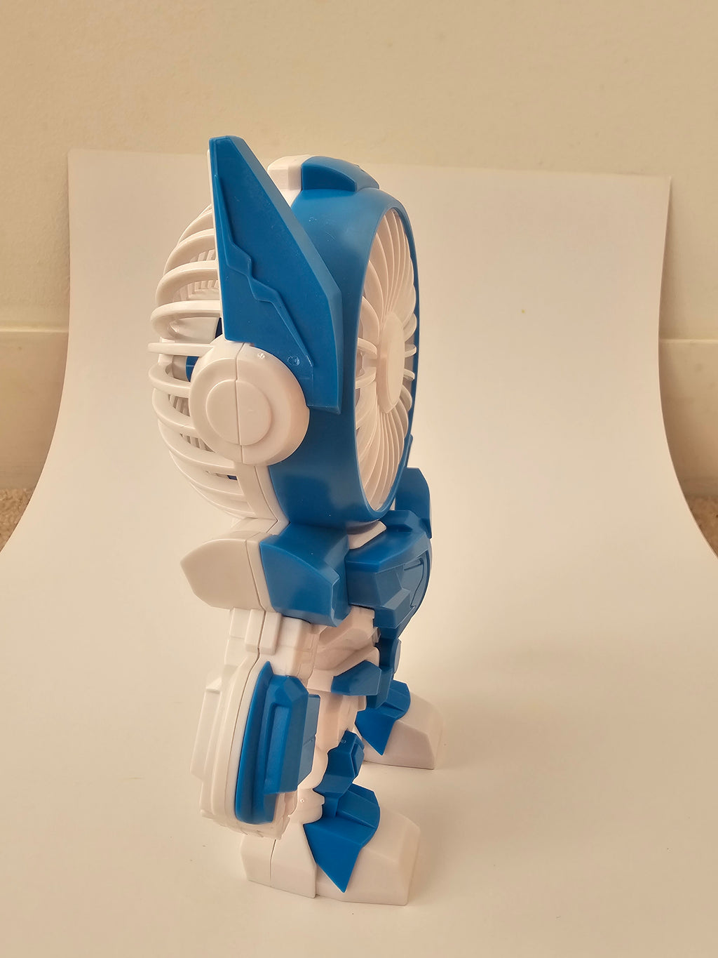 A futuristic robot-style handheld fan
