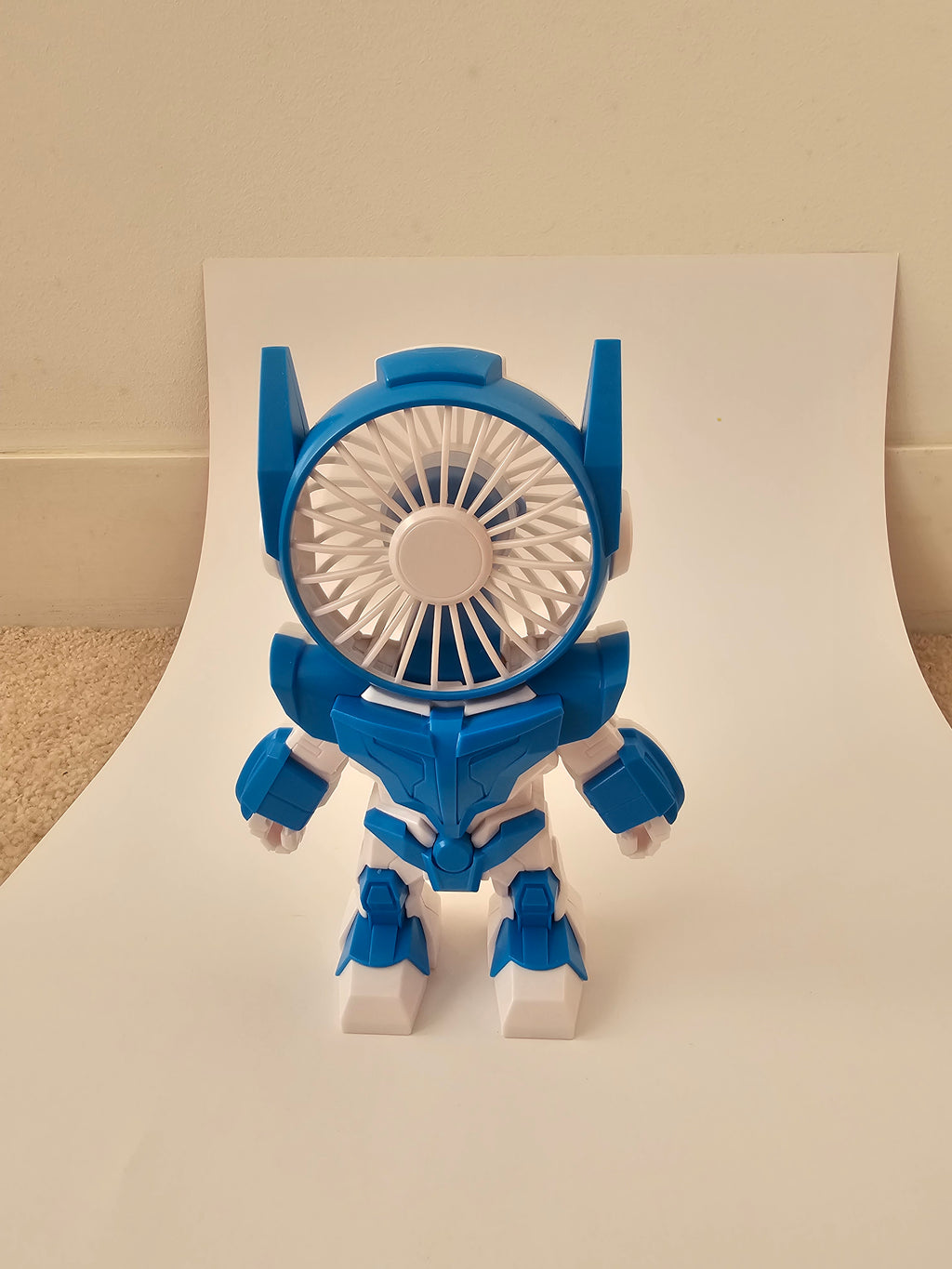 A futuristic robot-style handheld fan